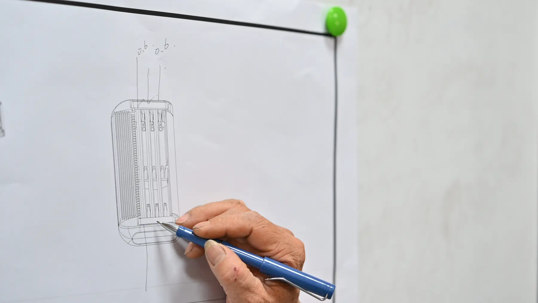 Kinghood engineering team discussing a product drawing